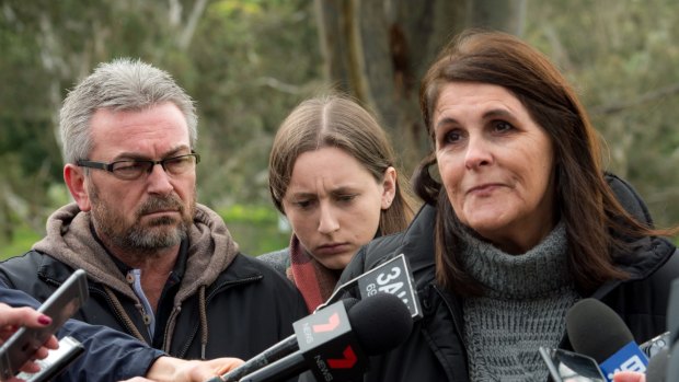 Patricia Gray, flanked by Karen's husband Borce and daughter Sarah, made the family's last public appeal for help.