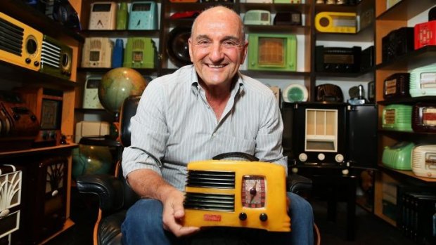 Peter Sheridan poses with his Art Deco radio collection.