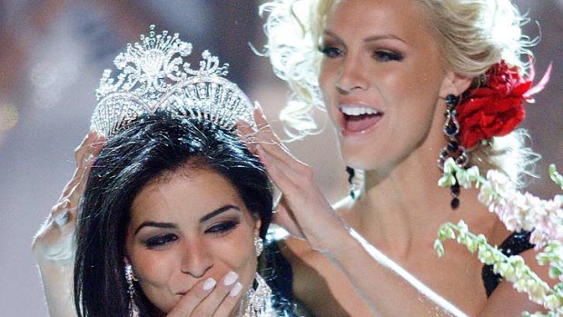 Too much champagne? ...  Rima Fakih is crowned Miss USA in 2010.