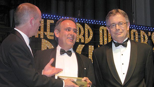Adrian Di Marco from TechnologyOne (centre) wins the Business Person of the Year award.