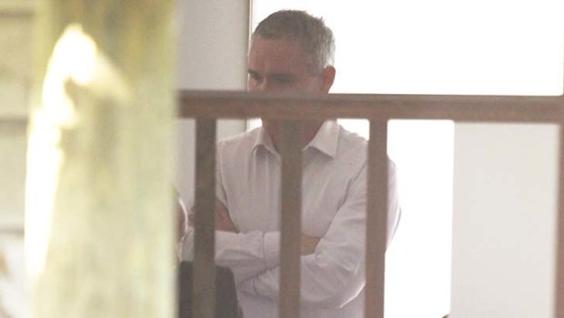 House raided ... Craig Thomson pictured in his home today.