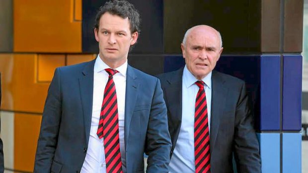 Essendon chief operating officer Xavier Campbell (left) and chairman Paul Little leave the Federal Court.