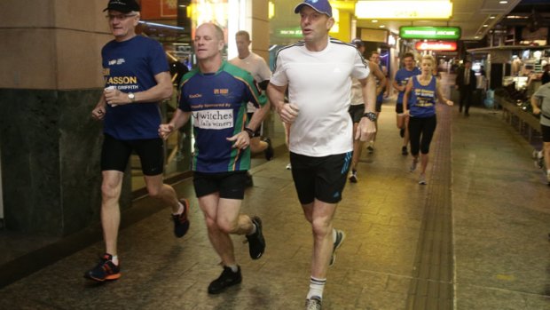 Tony Abbott goes out for an early morning run with Queensland Premier Campbell Newman, centre, in Brisbane on Saturday before flying out to Arnhem Land.