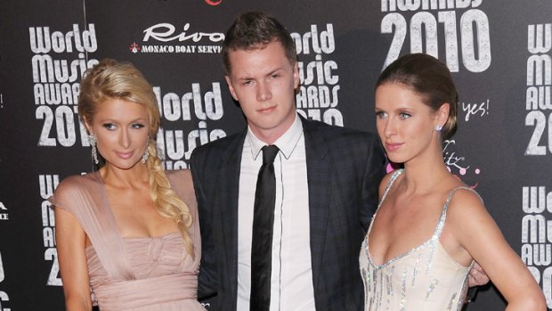 Compensation order ... Barron Hilton with sisters Paris, left, and Nicky.