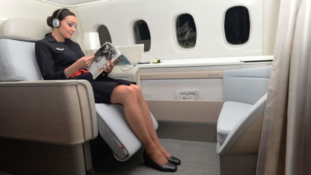An Air France attendant shows off the airline's 'haute couture' suite.