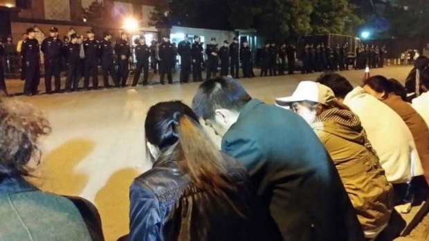 Desperate relatives: In a bid to meet with officials, family members of MH370 passengers stage an overnight protest outside the Malaysia embassy in Beijing.