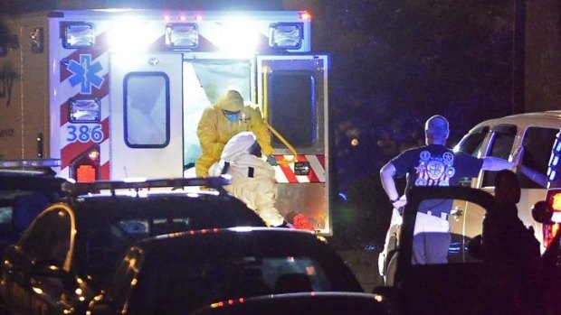 An ambulance carrying Amber Vinson, the second health care worker to be diagnosed with Ebola in Texas, arrives at Emory University Hospital in Atlanta.