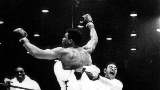 Angelo Dundee (r) celebrates as Cassius Clay [Muhammed Ali] is lifted off the ring floor after beating Sonny Liston in 1964.