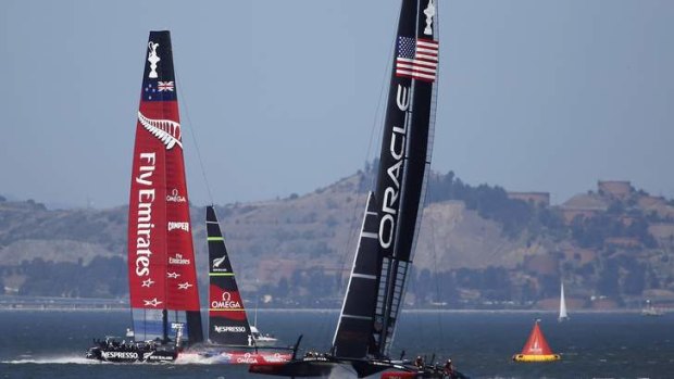 Emirates Team New Zealand, left, sails against Oracle Team USA during Race 17.