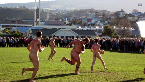 Cool runnings ... players strip down for a chilly match of nude rugby.