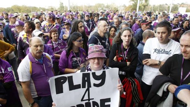 Purple army ... fans turned up in their thousands yesterday for the Storm at the team's first training session since the club was punished for salary cap breaches.