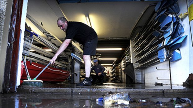 Greg Wotherspoon of Nithsdale Amateur Rowing Club cleans up after recent floodings in Dumfries, south-west Scotland.