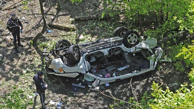 Seven dead ... the car plunged more than 50 feet.