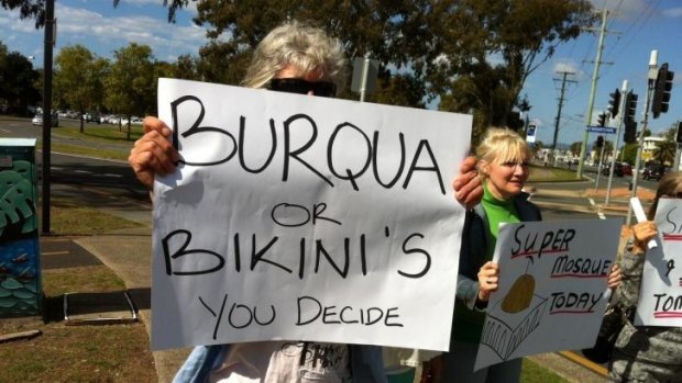 A small group of protesters oppose a proposed mosque in Currumbin.