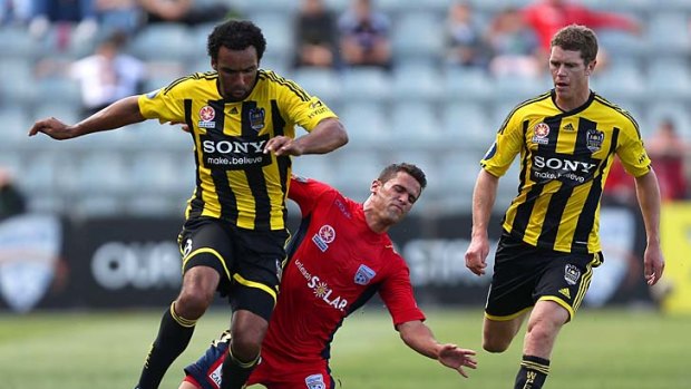 Not happy: Wellington Phoenix striker Paul Ifill (left) was at the receiving end on Sunday.