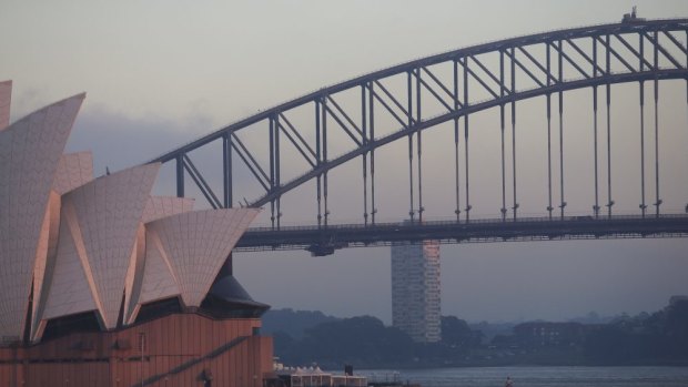 Smoke haze blankets Sydney Harbour after hazard reduction burns.