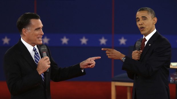 Former Massachusetts Gov. Mitt Romney and President Barack Obama spar during the second presidential debate in 2012. 