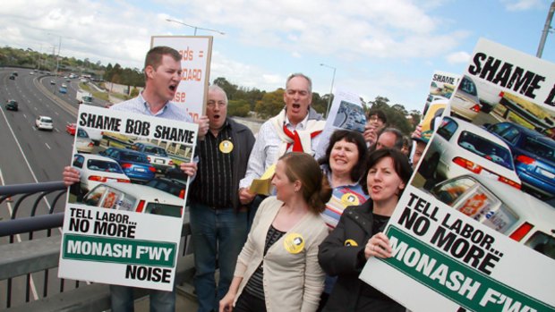 Justin McKernan (left) leads a protest at freeway noise.