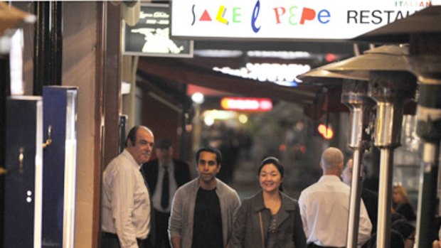 A lone spruiker apparently breaks the shortlived agreement by a group of Lygon Street restaurants to stop the practice.