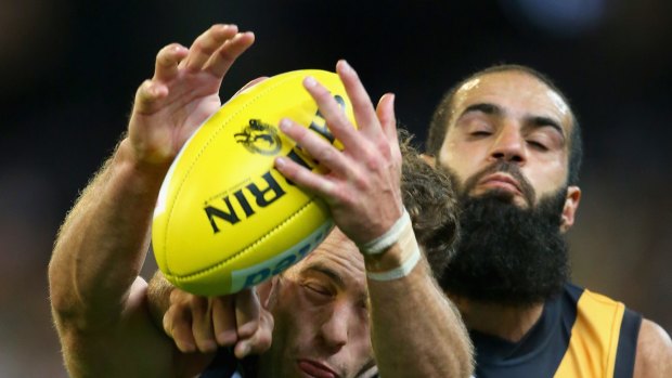 Bachar Houli, of the Tigers, and Jarryd Blair, of the Magpies, during Friday night's controversial game.