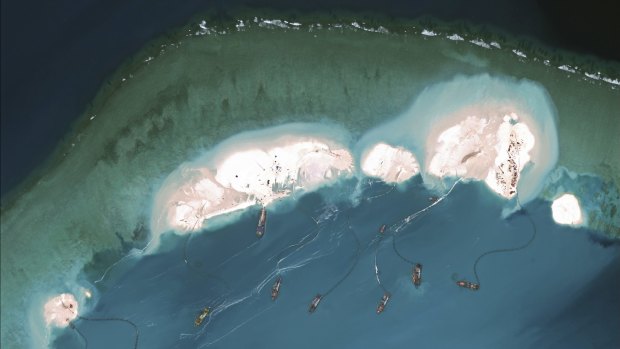 Chinese dredgers working at the northern-most reclamation site of Mischief Reef, part of the Spratly Islands, in the South China Sea, on March 17.