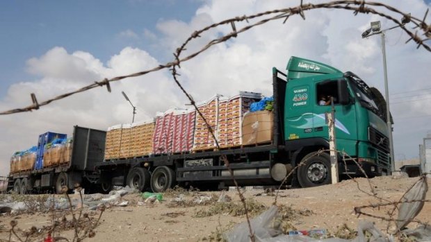 A truck loaded with goods enters the Gaza Strip from Israel through the Kerem Shalom crossing in Rafah, southern Gaza. 