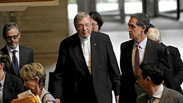 Cardinal George Pell leaves the Royal Commission into Institutional Responses to Child Sexual Abuse, after giving evidence.