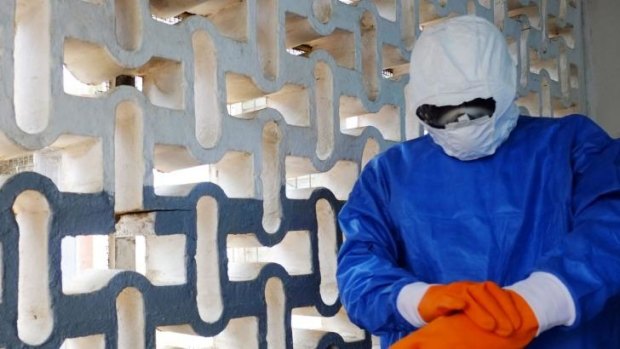 A medical worker of the John Fitzgerald Kennedy hospital of Monrovia prepares to treat Ebola patients.