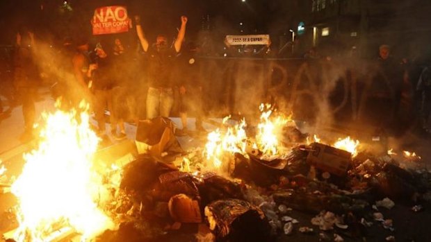 Demonstrators hold a sign proclaiming 'You are not going to have cup' in Sao Paulo.