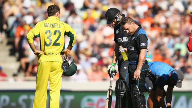 MOMENT OF WORRY: Glenn Maxwell of Australia looks on as Brendon McCullum examines his bruised arm. 