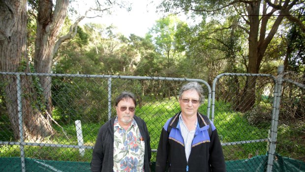 Gavin Gatenby and Paul Craven at the site of woodland about to be cleared for the WestConnex project.