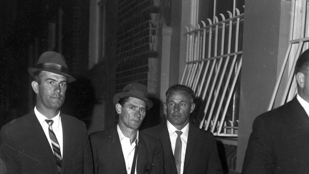 Melbourne prison escapees, Ronald Ryan and Peter Walker, are taken to police headquarters in Sydney after their recapture, January 5,1966.
