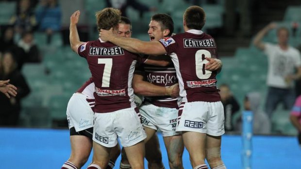 Seats available ... Matt Ballin scores for Manly against the Cowboys.