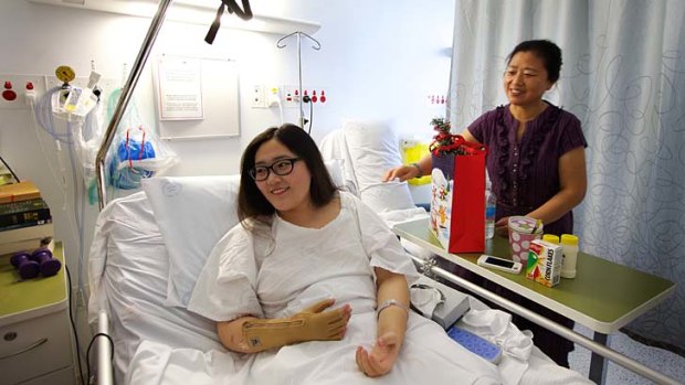 Broken bones and burns ... Yinuo Jiang will learn to walk again at Liverpool Hospital and wants to return to university in February to start her teaching degree.