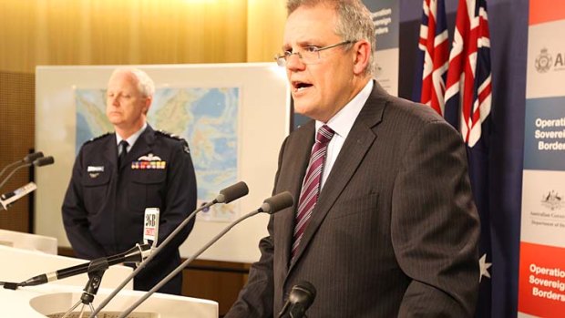 Immigration Minister Scott Morrison and Operation Sovereign Borders acting commander, Air Marshal Mark Binskin, attend the weekly update in Sydney.