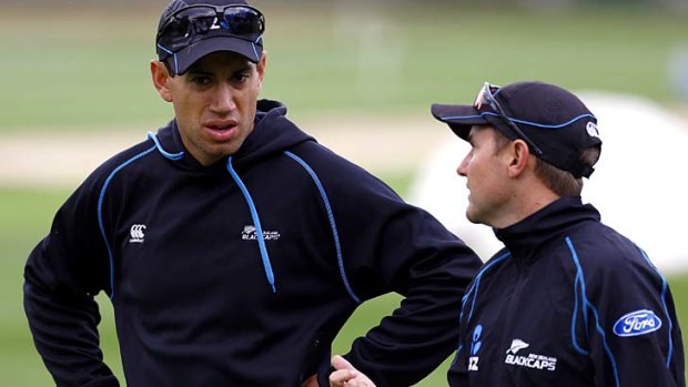 Former New Zealand captain Ross Taylor has a chat with coach Mike Hesson during a training session in Dunedin.