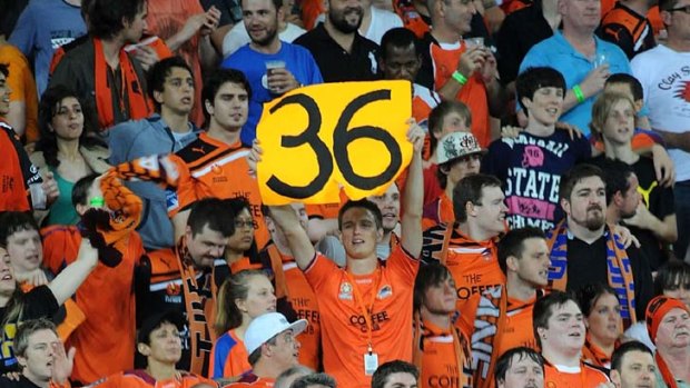 Record breaking ...Roar fans cheer during the round eight A-League match between Brisbane and the Perth Glory at Suncorp Stadium on November 26.