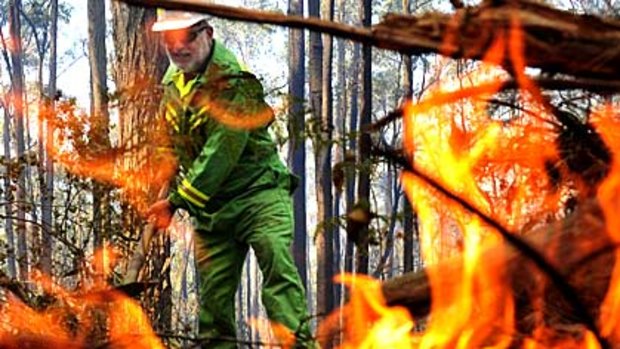 A firefighter works on the Bunyip State Park blaze.