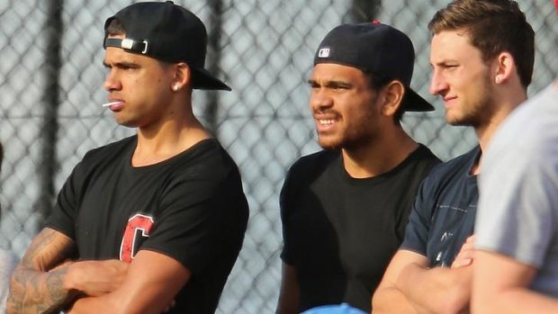 Cyril Rioli (centre) watches the VFL preliminary final between Box Hill and Williamstown on Sunday.