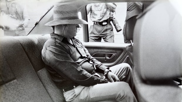 Eastman, handcuffed, sits alone in the rear of a police car shortly after his arrest in December 1992. 