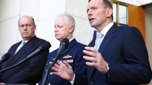 Defence Minister David Johnston (left) with Prime Minister Tony Abbott and chief of the Defence Force Air Chief Marshal Mark Binskin.