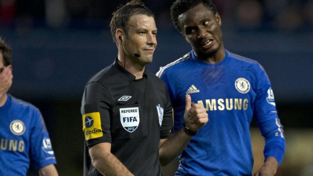Racial abuse claim ... Chelsea's Nigerian midfielder John Obi Mikel talks with referee Mark Clattenburg.