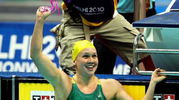 Kylie Palmer celebrates after winning Australia's first gold medal of the Games.