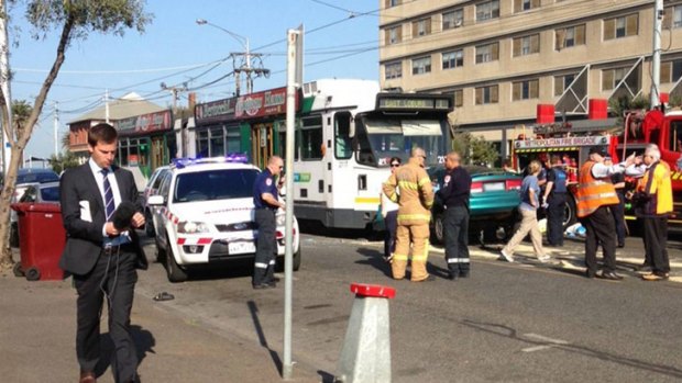 Police say the driver of the sedan was seen swerving over tram lines before the fatal collision.
