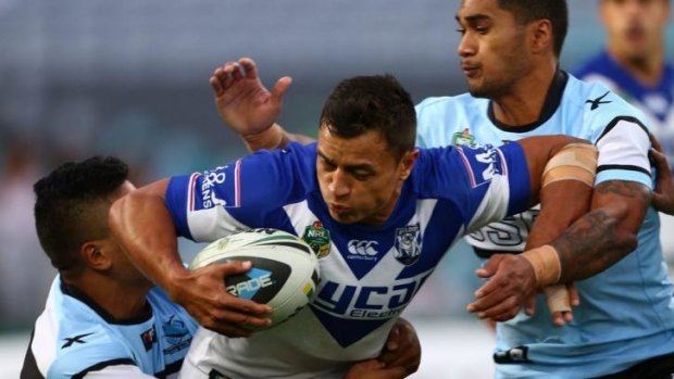 New home: Sam Perrett takes on the Cronulla defence.