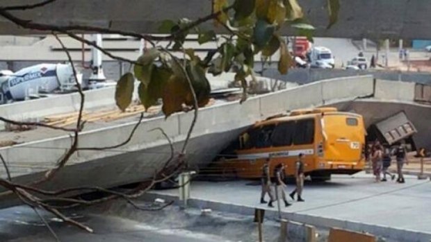 Bus crushed under collapsed overpass in Brazil.