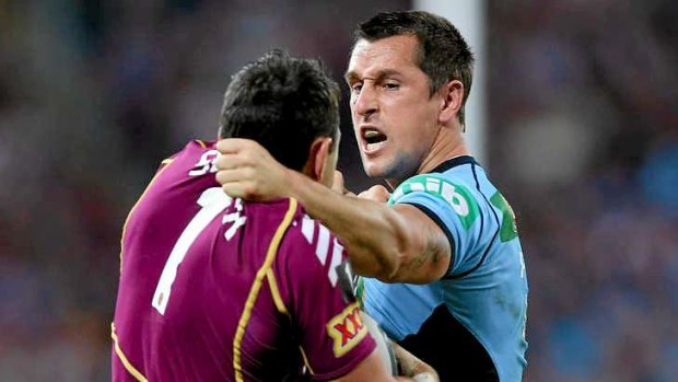 Mitchell Pearce and Billy Slater grapple during game two of the State of Origin.