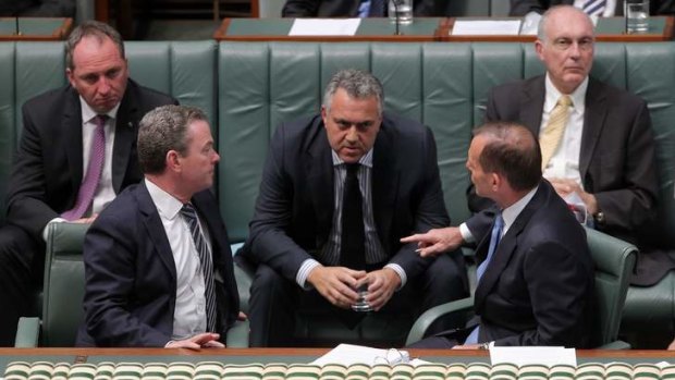 Commanding: Treasurer Joe Hockey, centre - with Prime Minister Tony Abbott, right - has emerged as the dominant figure in the new government.