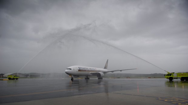 Water cannon greeted the first Singapore Airlines flight.