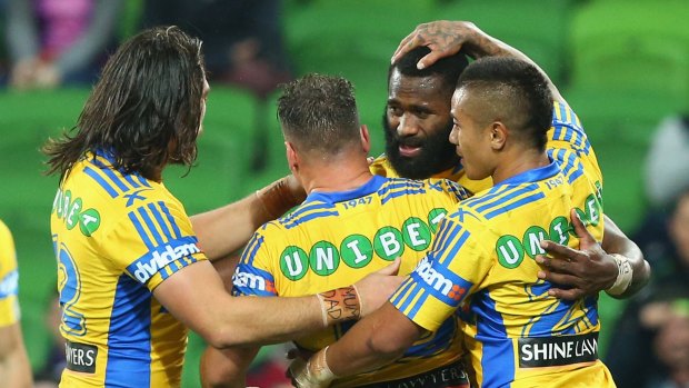 You ought to be congratulated: Parramatta winger Semi Radradra celebrates with teammates after scoring his first try.